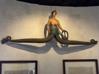 Two-tailed mermaid sign