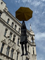 Woman with umbrella statue, name unknown